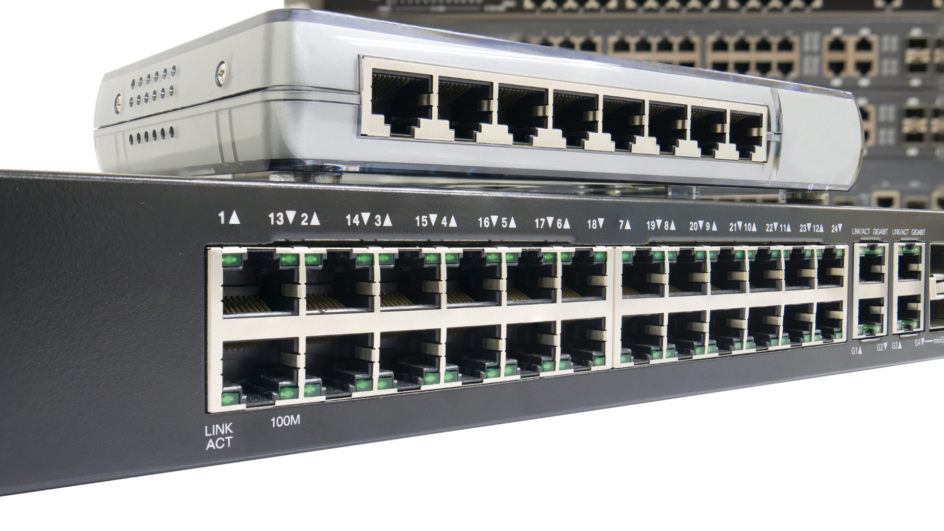 Two cisco switches are stacked on top of each other