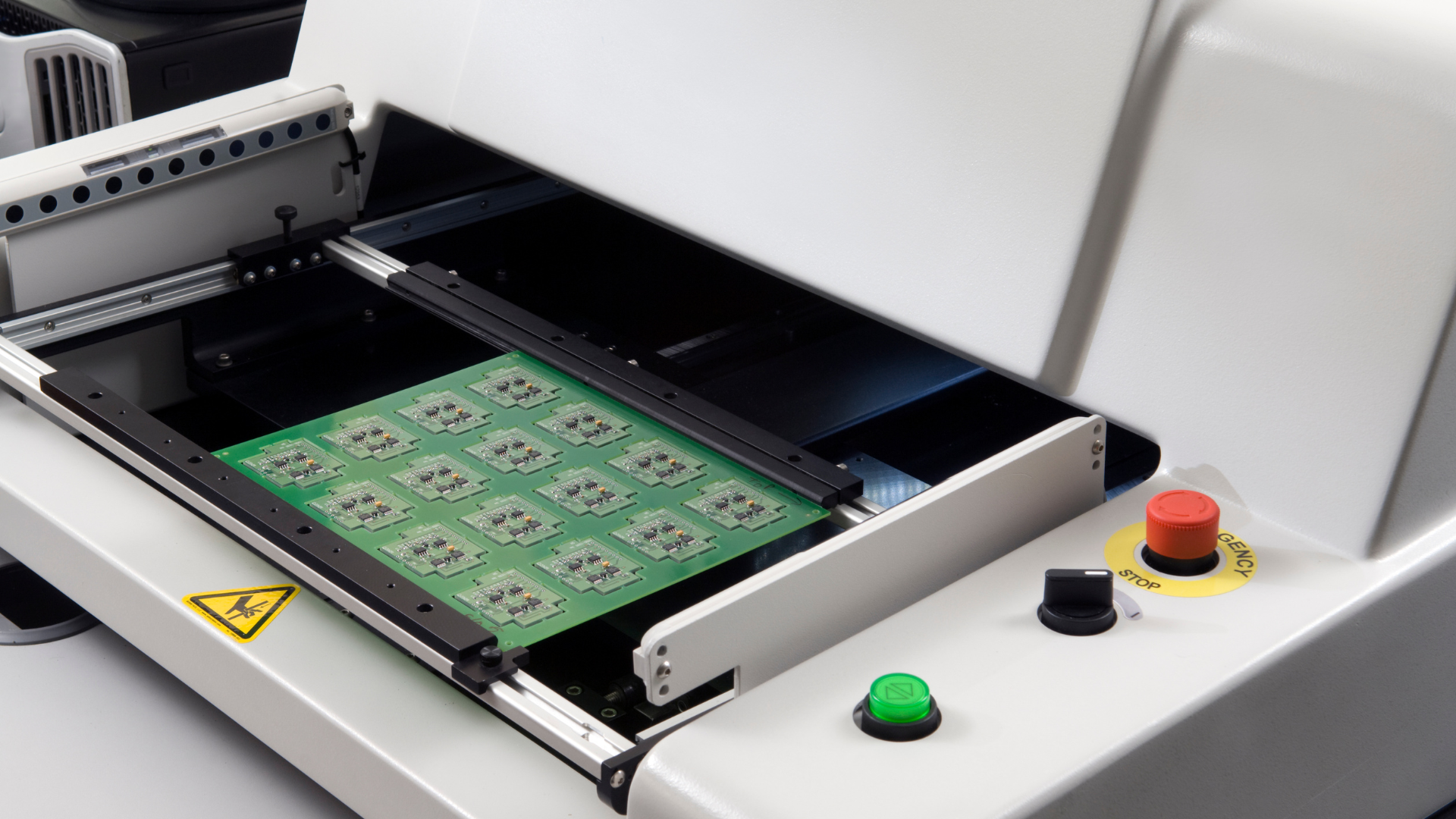 A machine is scanning a piece of paper with numbers on it