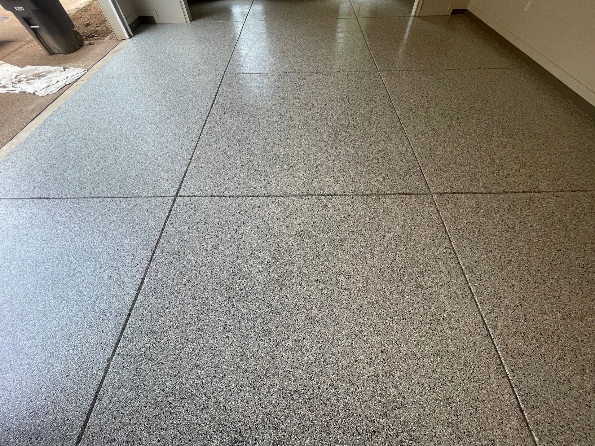 A close up of a tiled floor in a room.