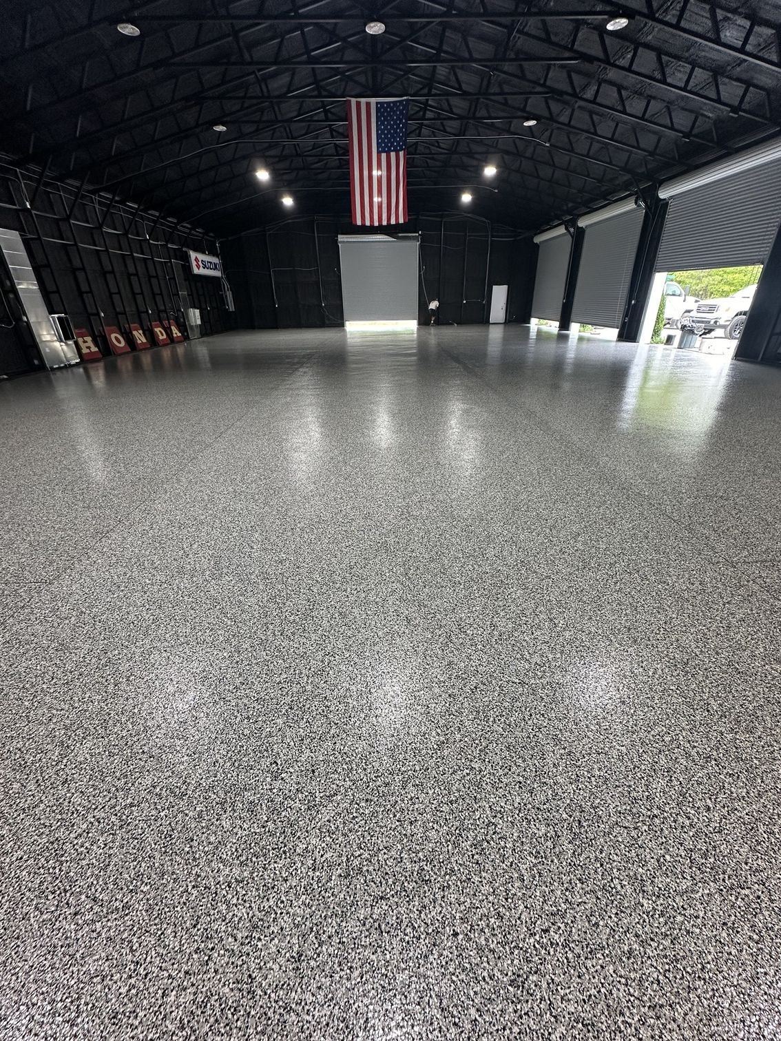 A large garage with a flag on top of it.