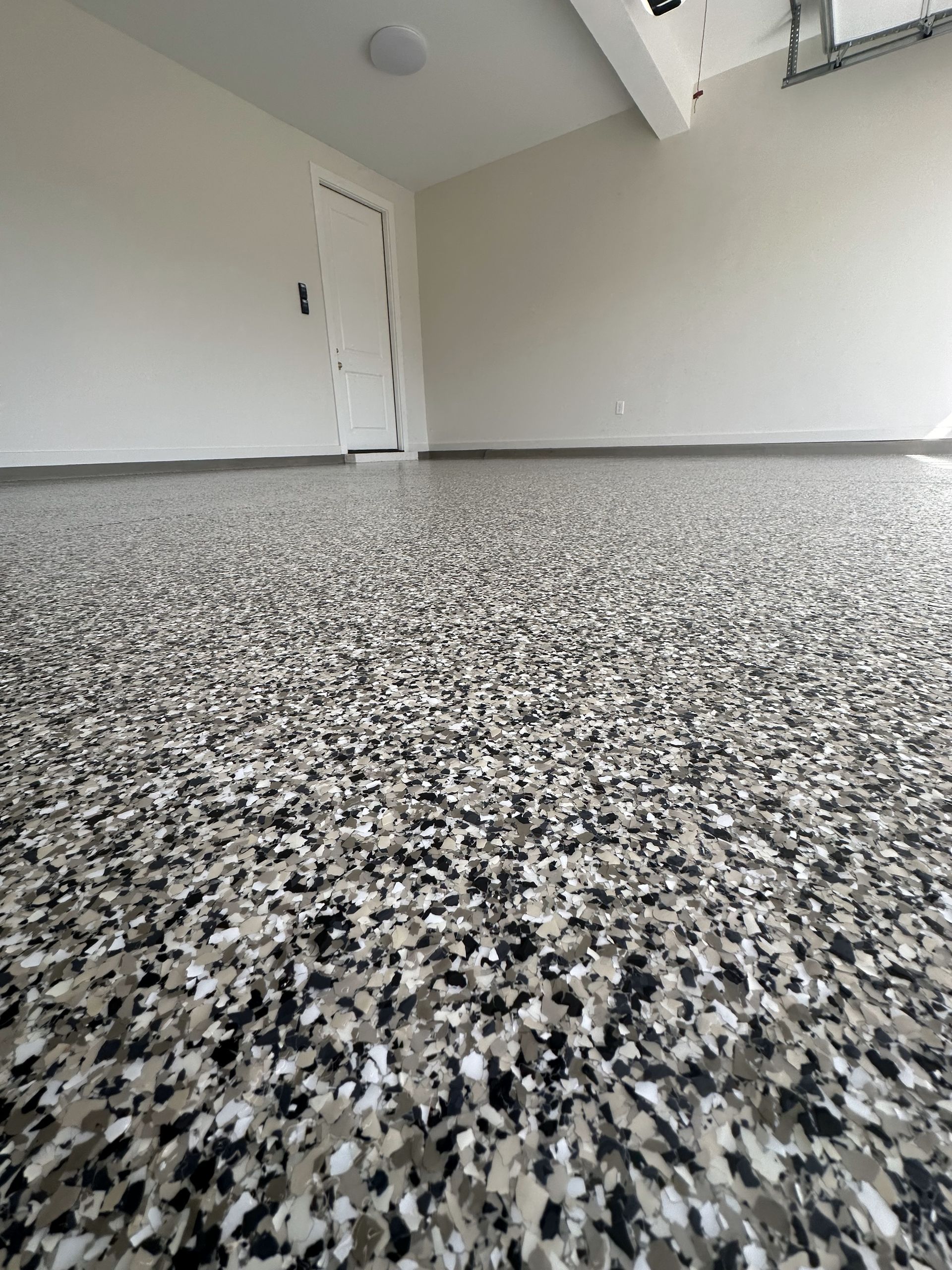 A close up of a garage floor with a camouflage pattern.