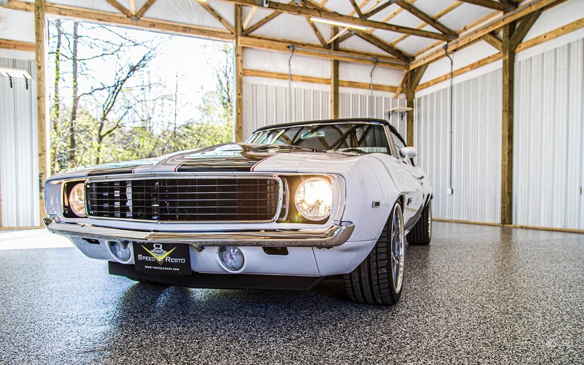 White classic car in a garage with epoxy garage floor