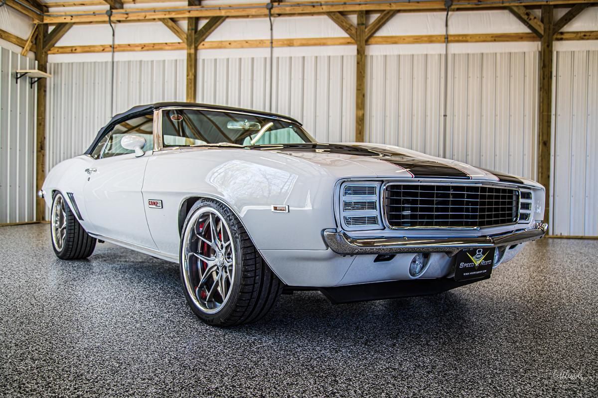 White classic car in a garage with epoxy garage floor