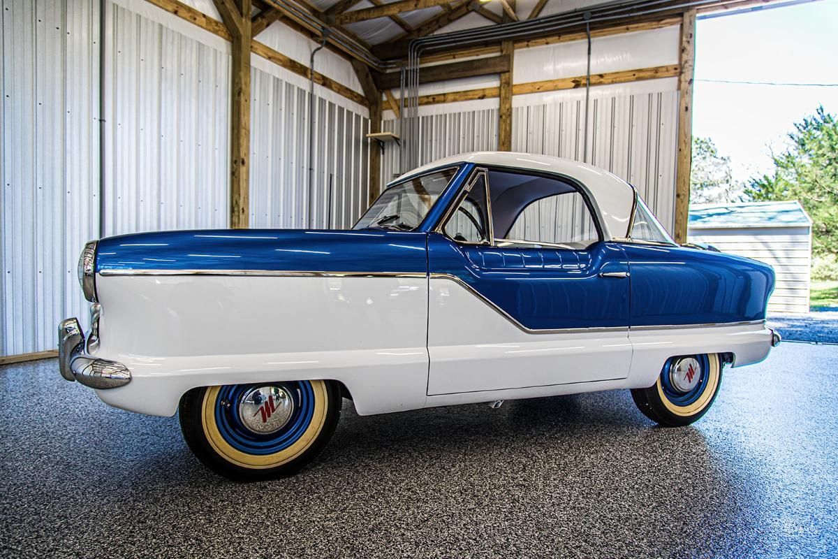 Blue and white classic car in a garage with epoxy garage floor