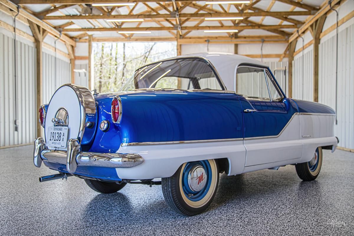 Blue and white classic car in a garage with epoxy garage floor