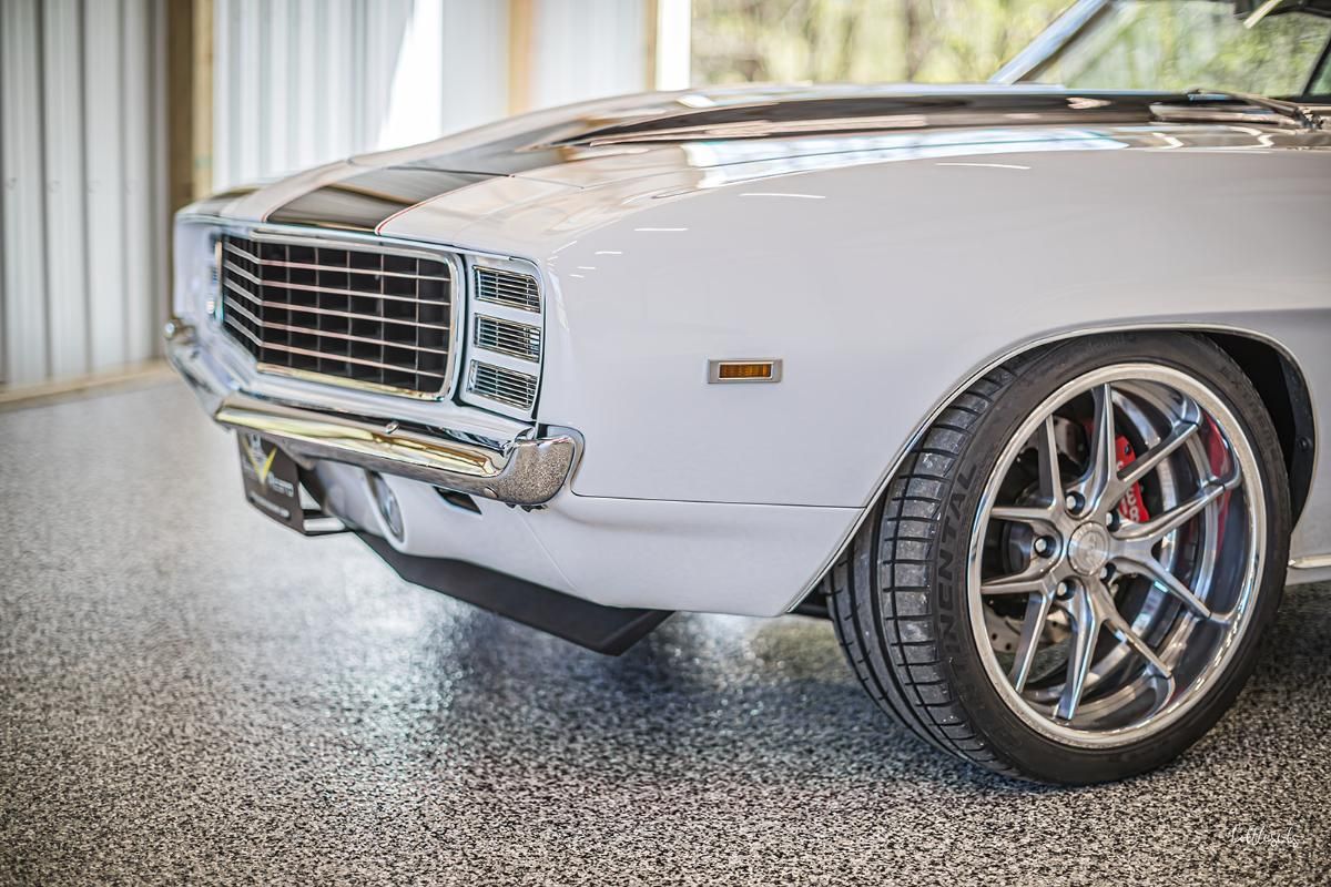 White classic car in a garage with epoxy garage floor
