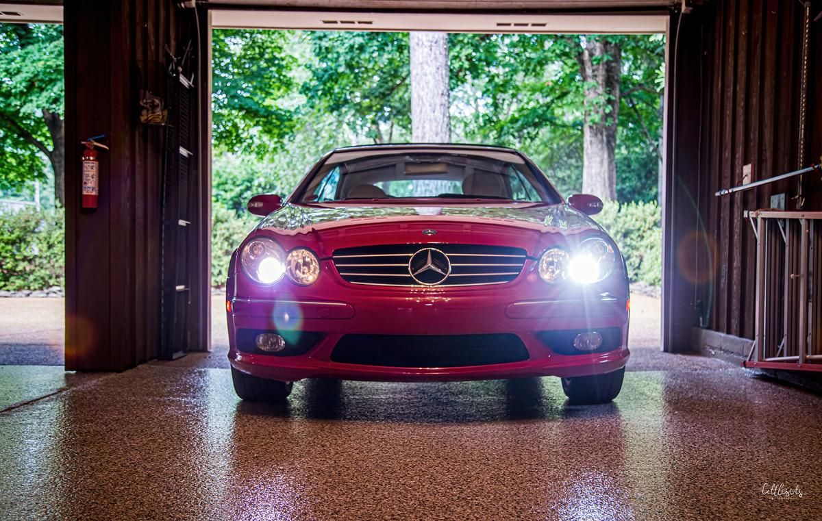 Red luxury car in a garage with epoxy garage floor