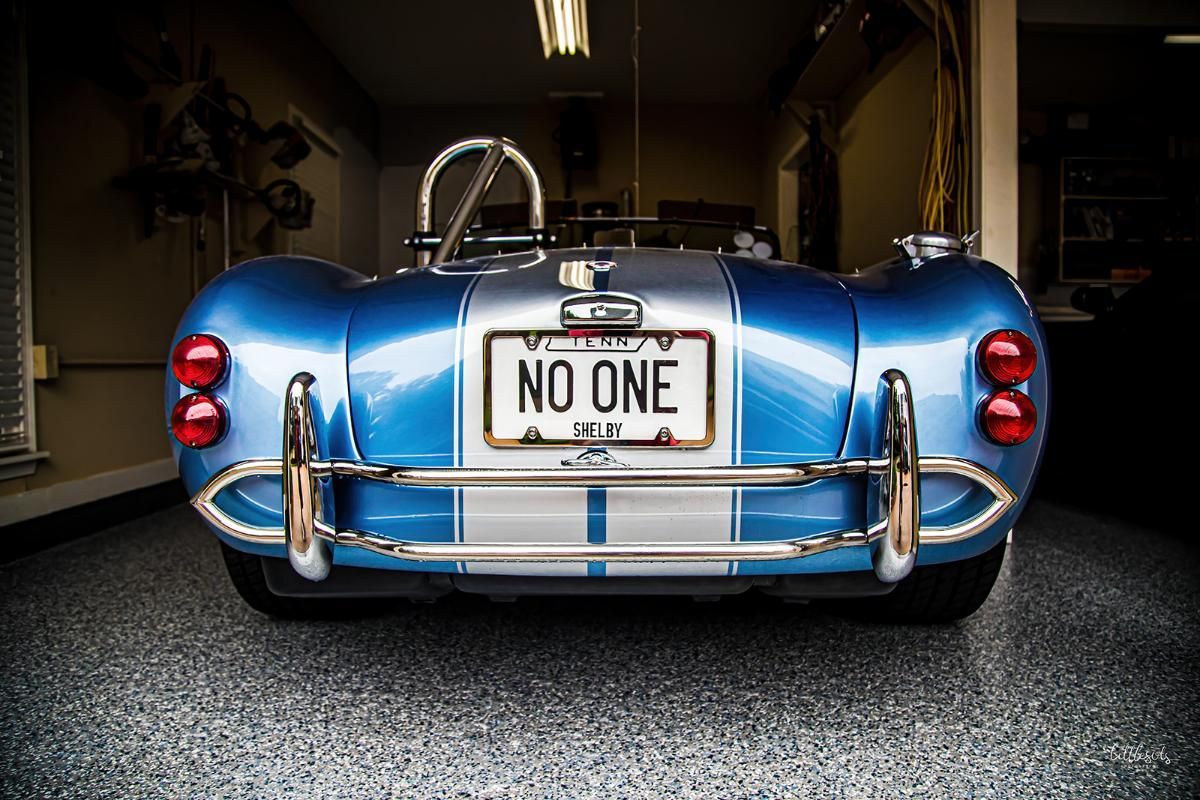 Blue classic car in a garage with epoxy garage floor