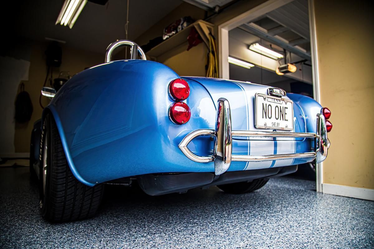 Blue classic car in a garage with epoxy garage floor