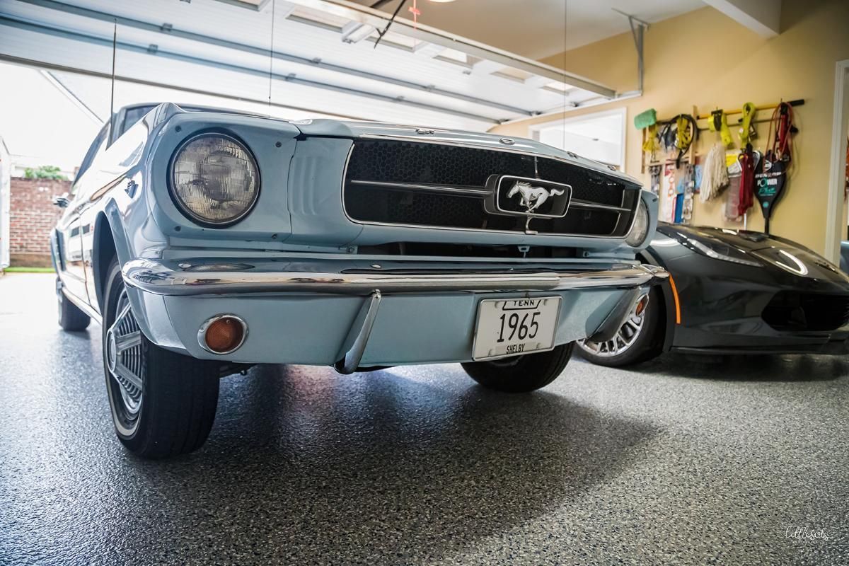 Light blue classic car in a garage with epoxy garage floor
