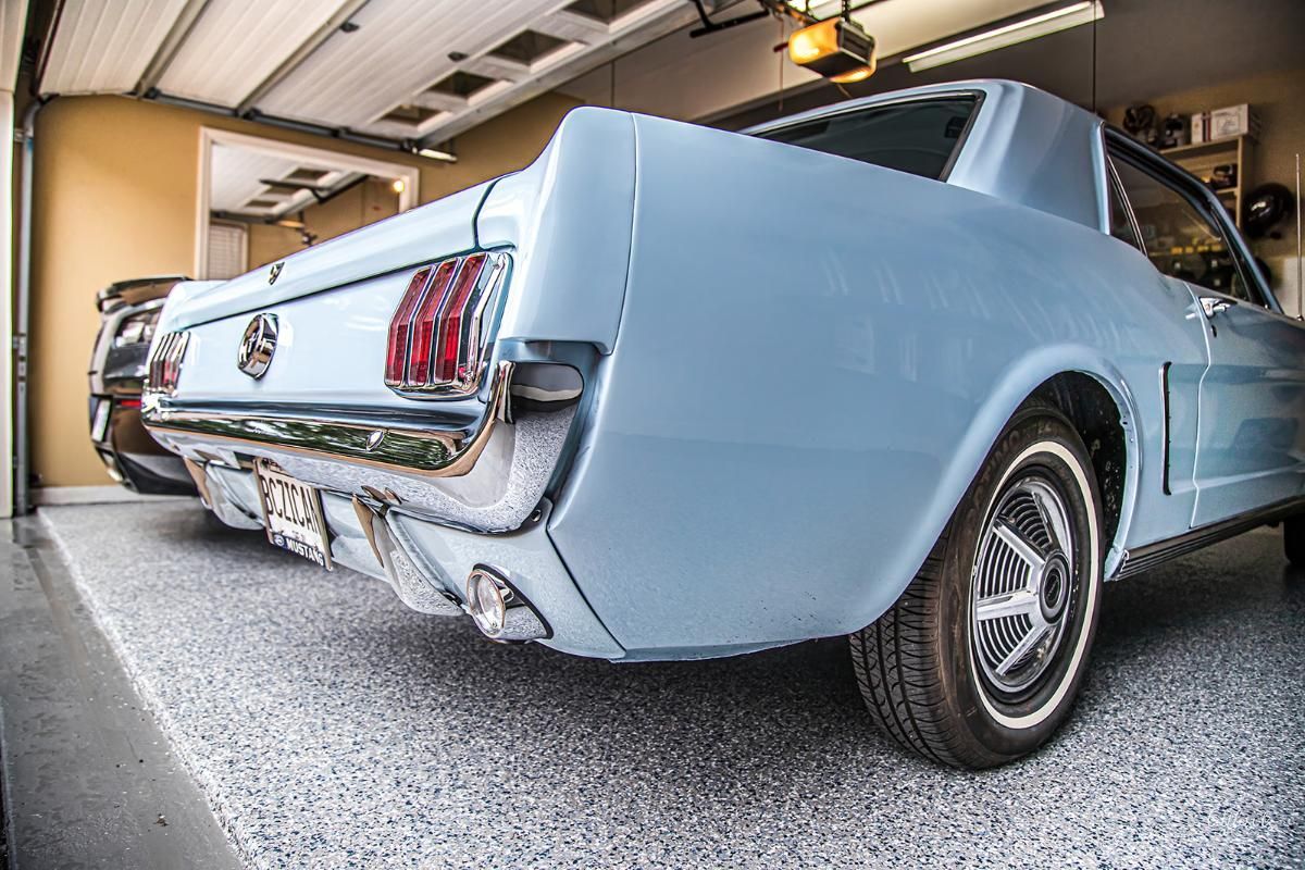 Light blue classic car in a garage with epoxy garage floor