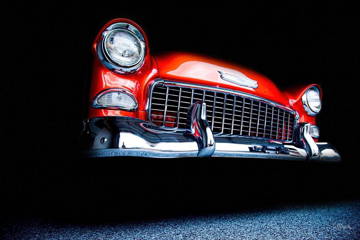 Red classic car in a garage with epoxy garage floor