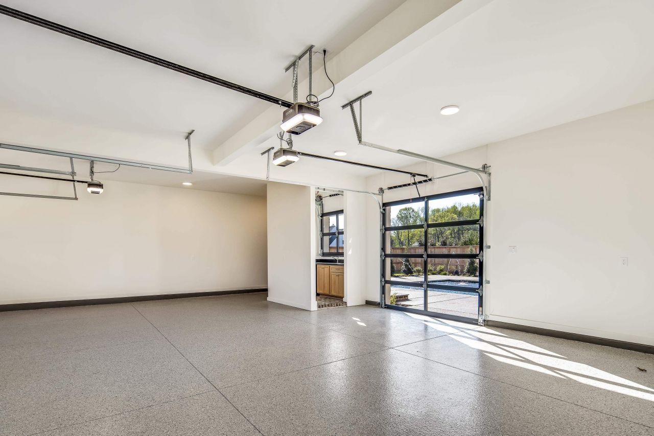 DEAS Garage Floors installation featuring Feather Gray flake in a clean, modern residential garage.