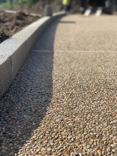 Close-up of new footpath and edging stones