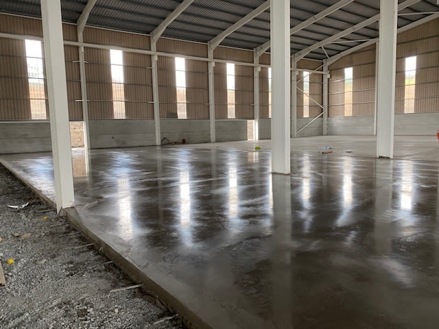 Partially set concrete flooring in a warehouse