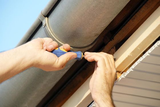 worker using a screwdriver