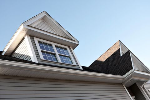 big house with window near the roof