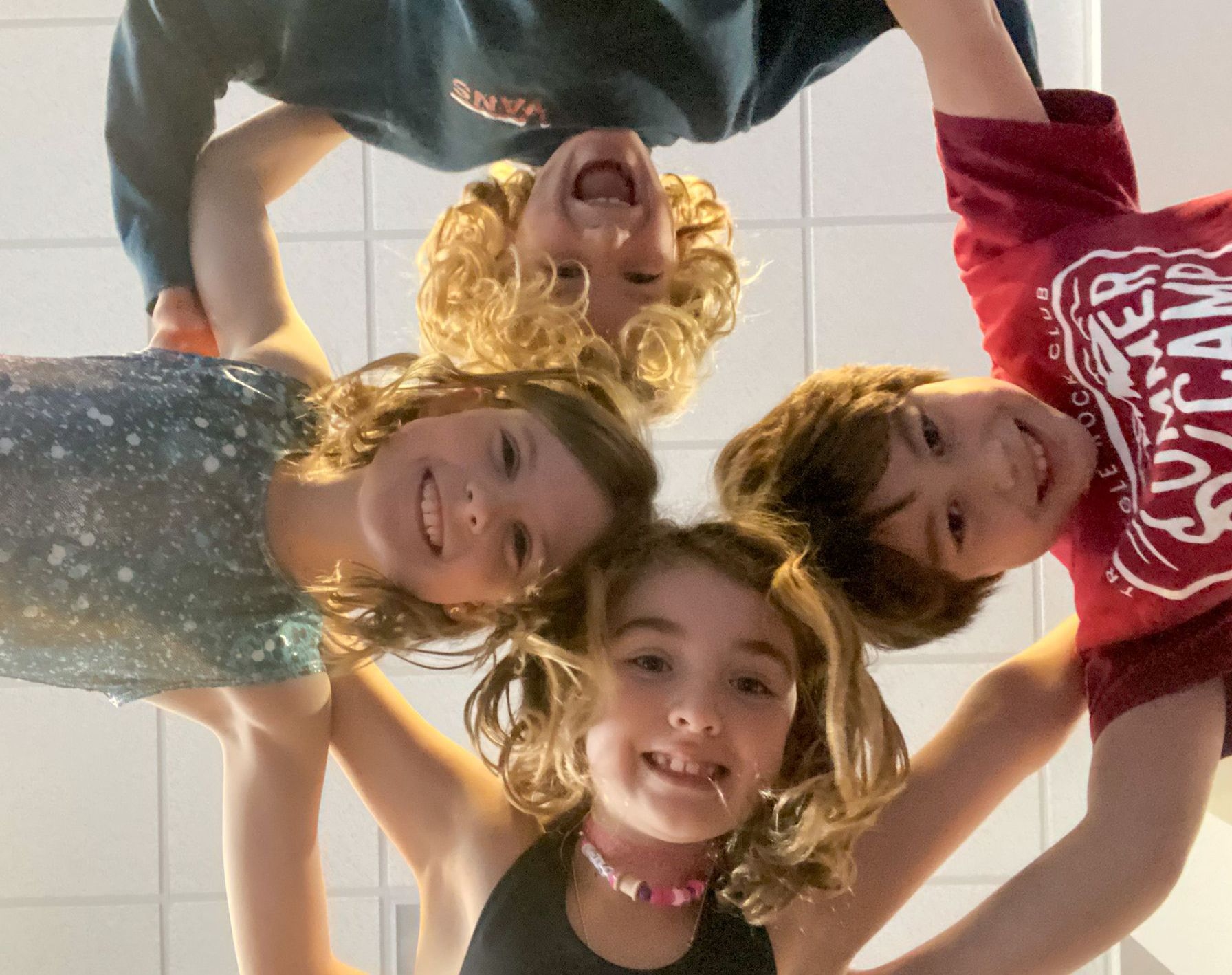 A bunny is holding a top hat and a bowl of candy.