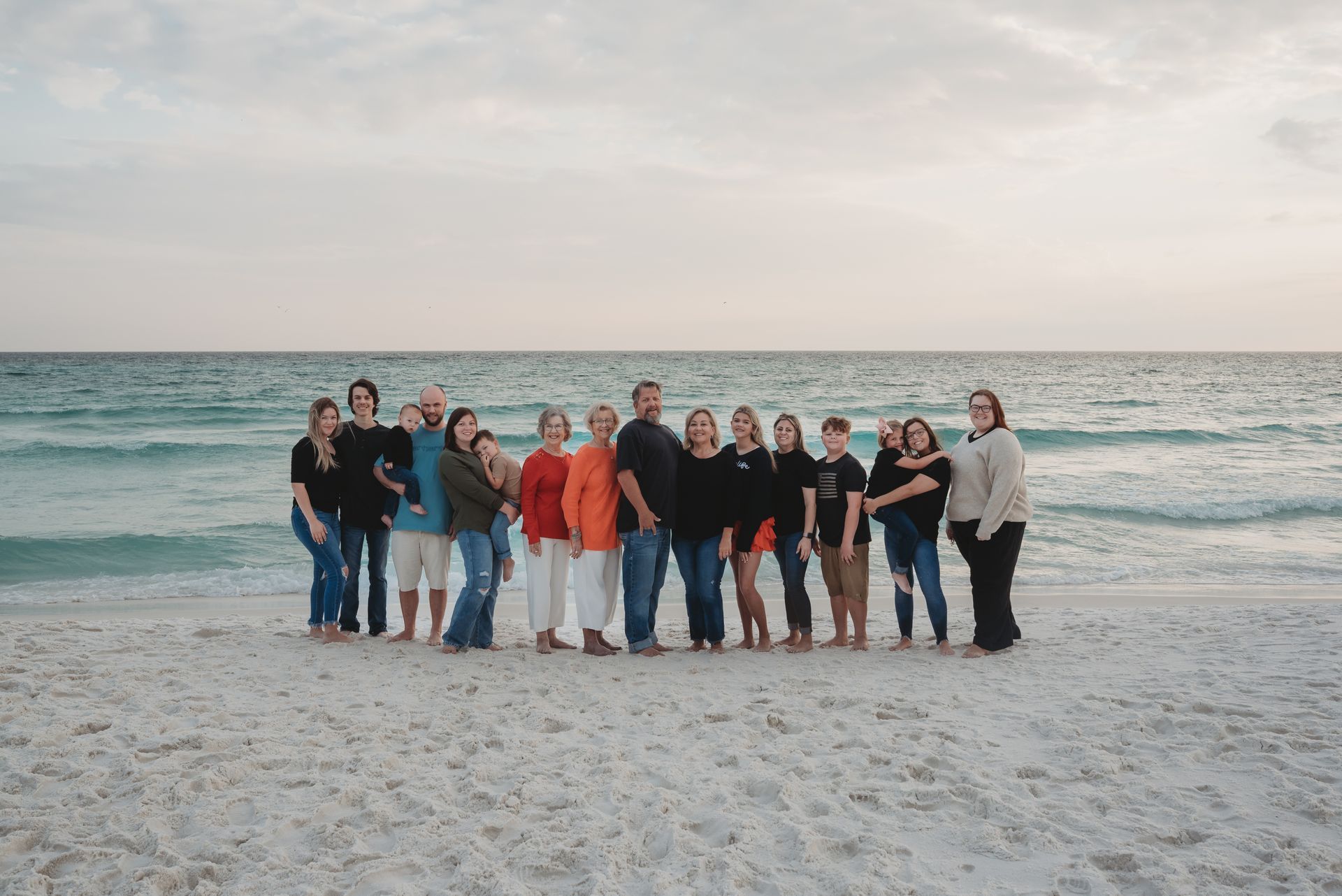 Two men in blue shirts are sitting next to each other