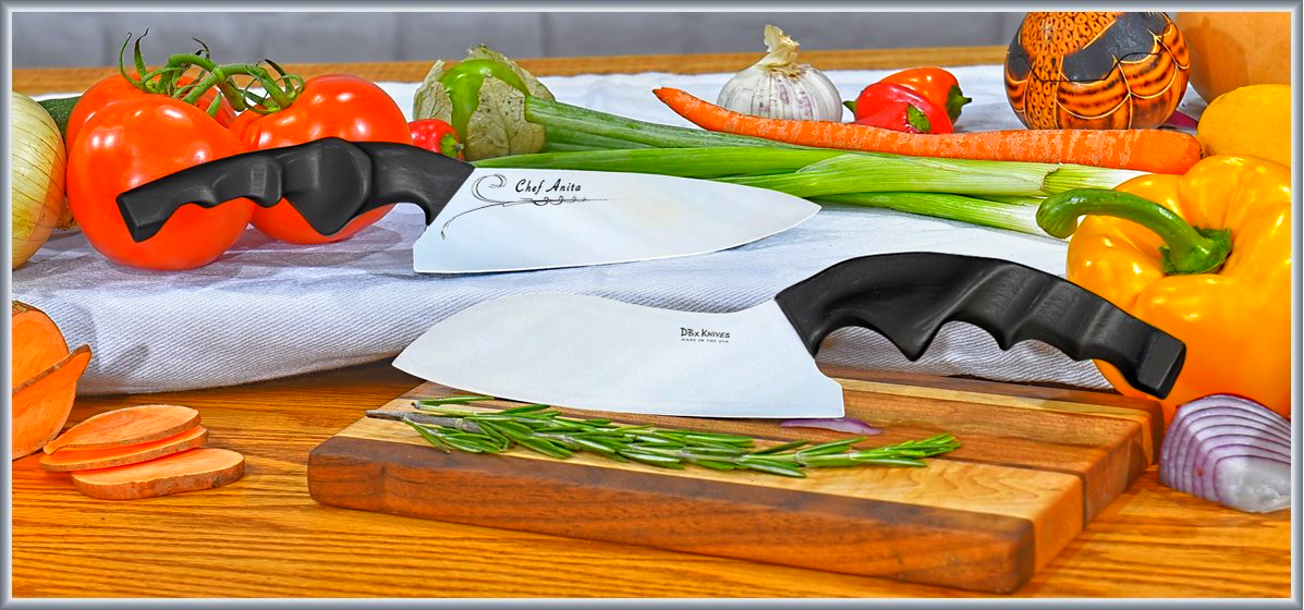 A cutting board with Handmade Chef Knives & cut vegetables.