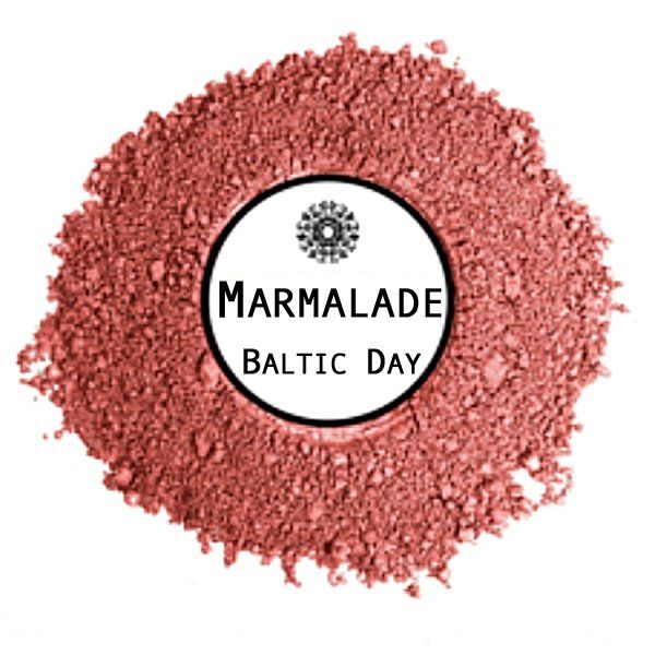 A pile of marmalade baltic day powder on a white background