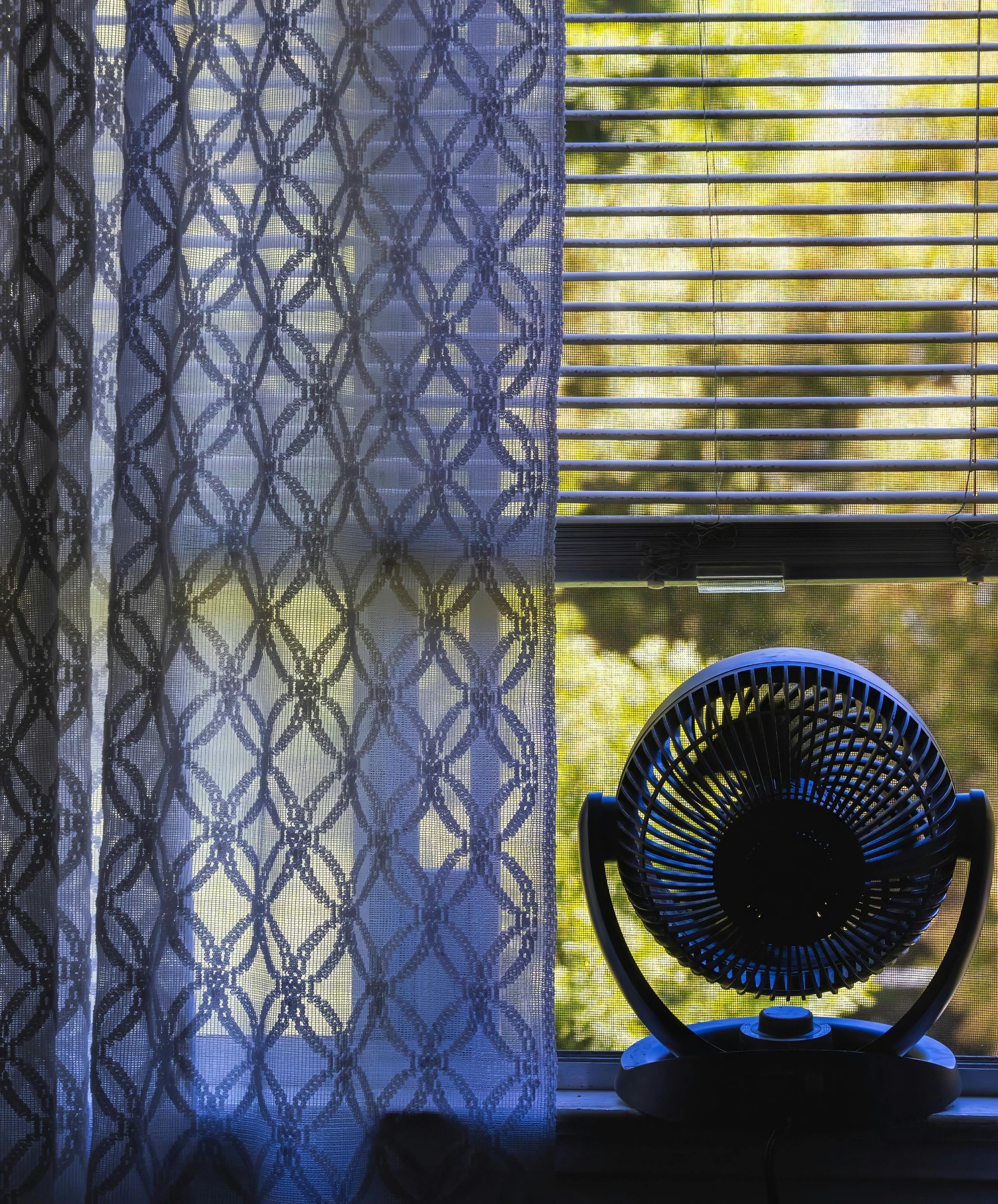 A fan in the window to keep apartment cool