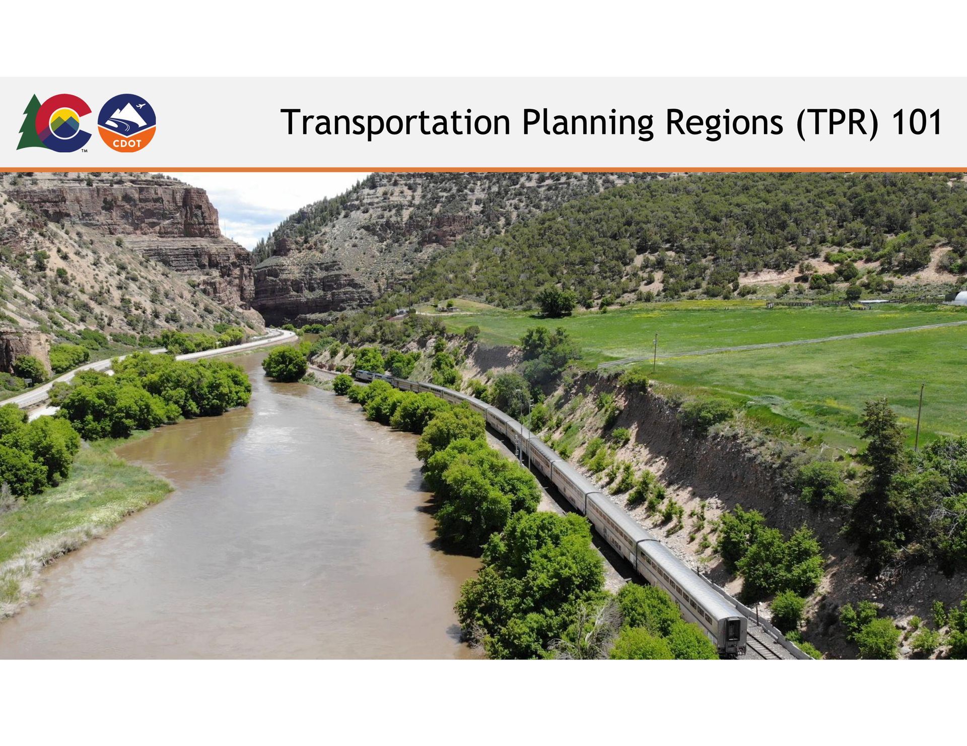 A train is going down a river in the transportation planning regions