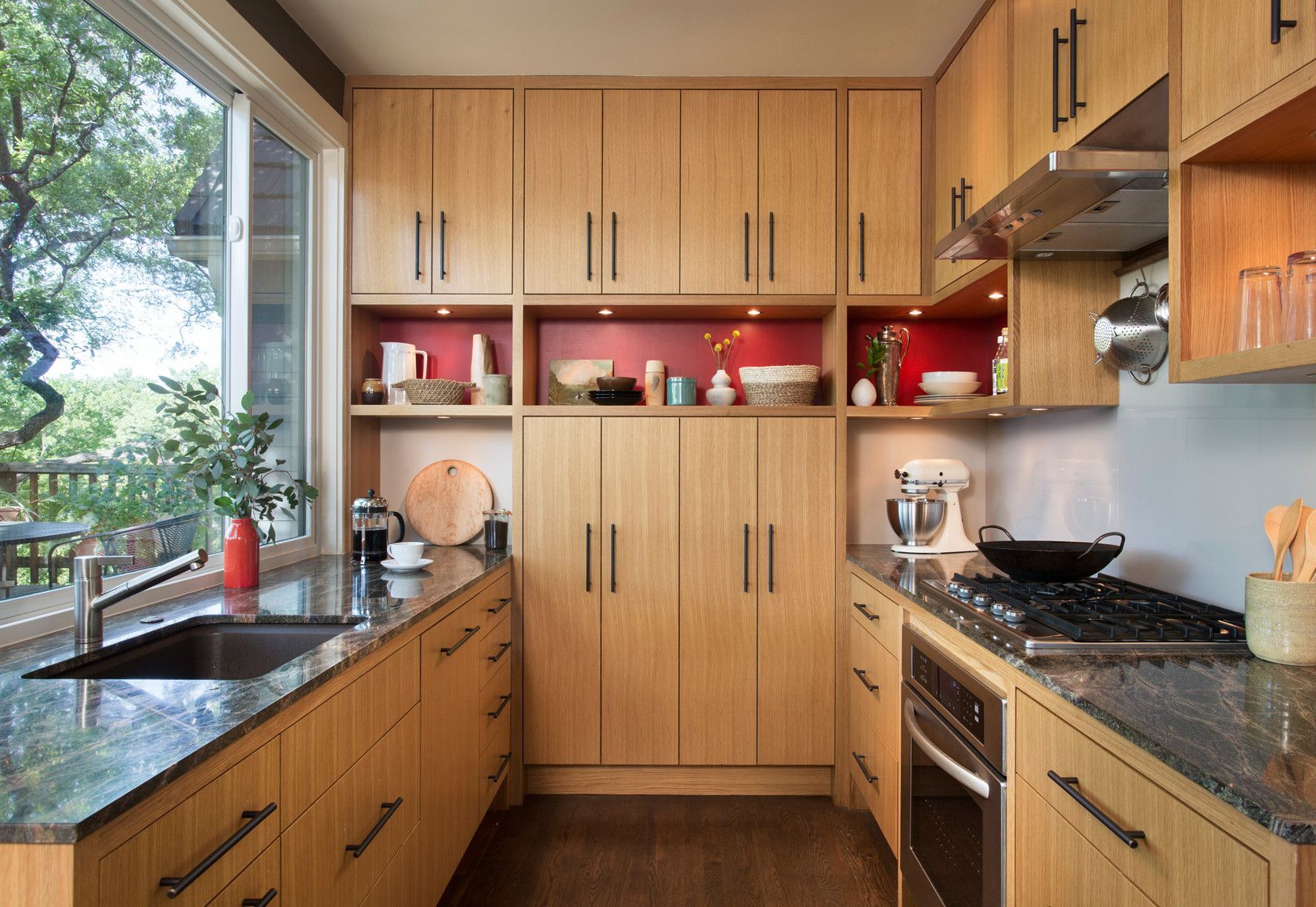 A kitchen with wooden cabinets and granite counter tops
