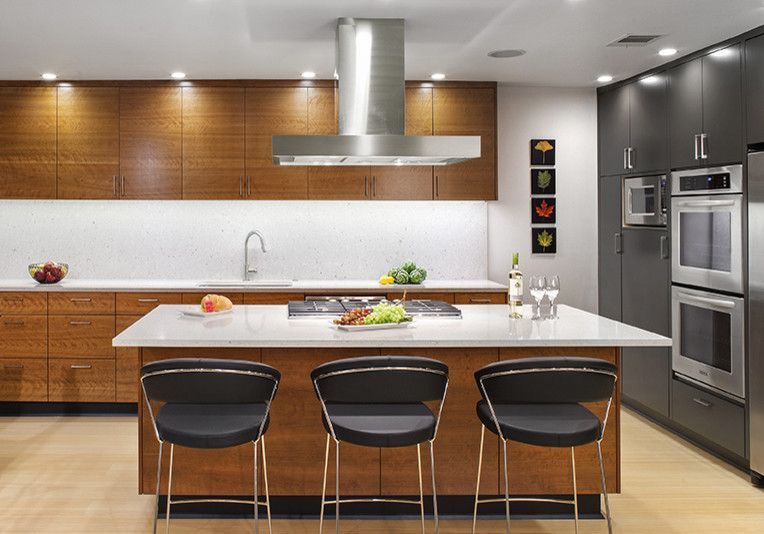 A kitchen with stainless steel appliances and wooden cabinets