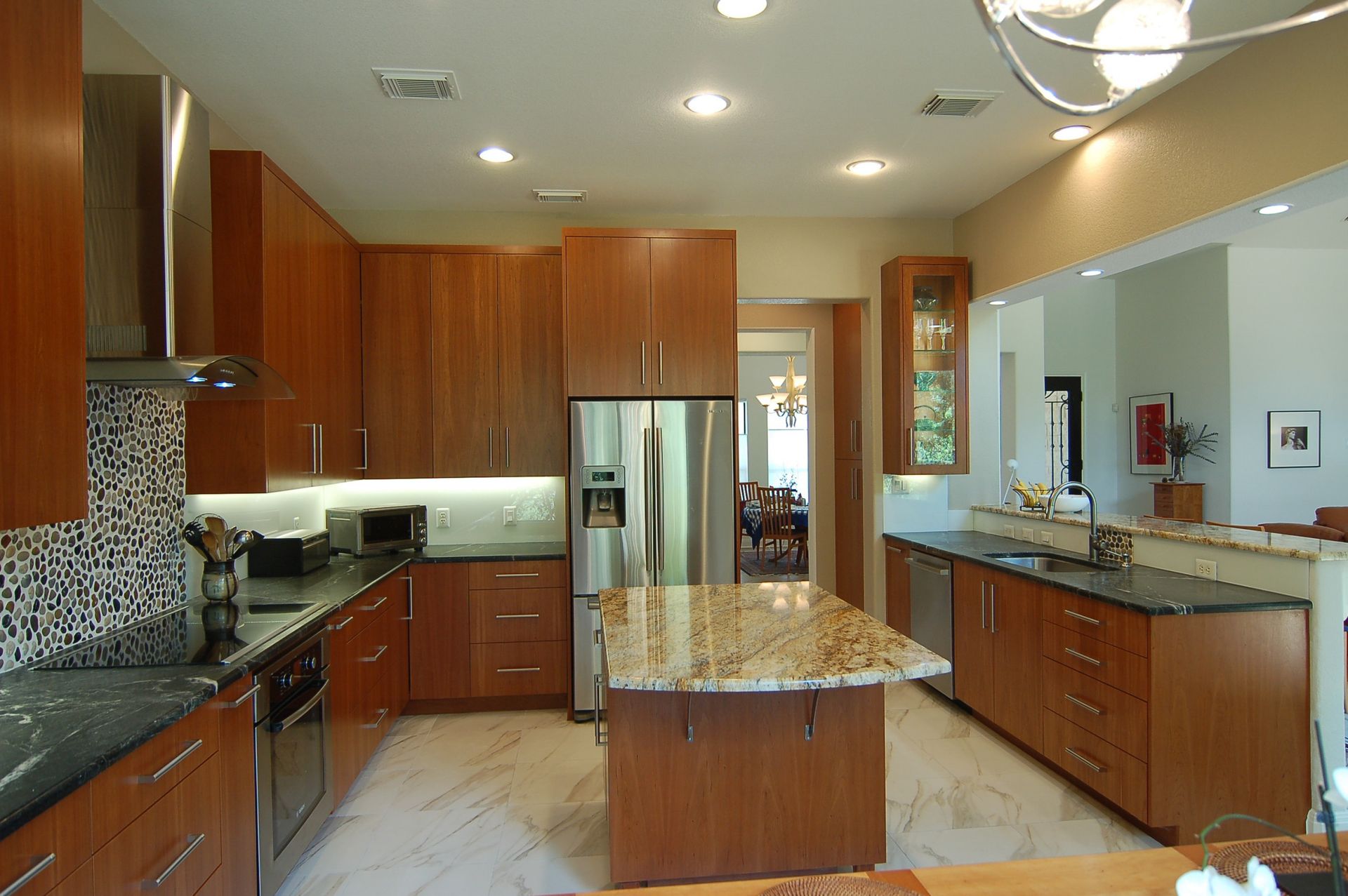 A kitchen with stainless steel appliances and granite counter tops