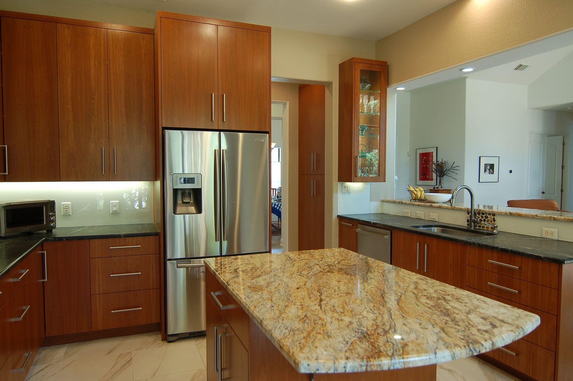 A kitchen with stainless steel appliances and granite counter tops