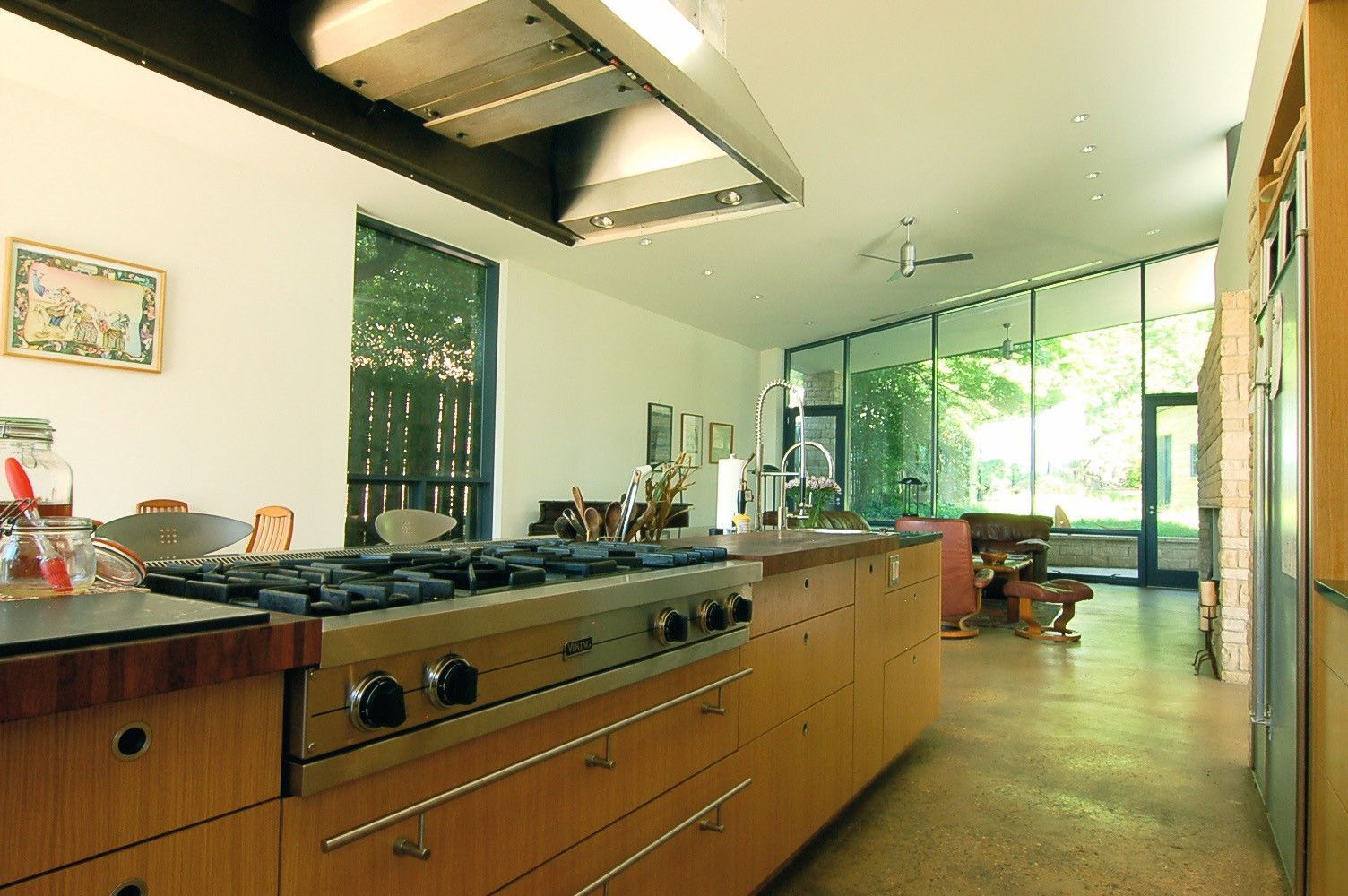 A kitchen with stainless steel appliances and wooden cabinets