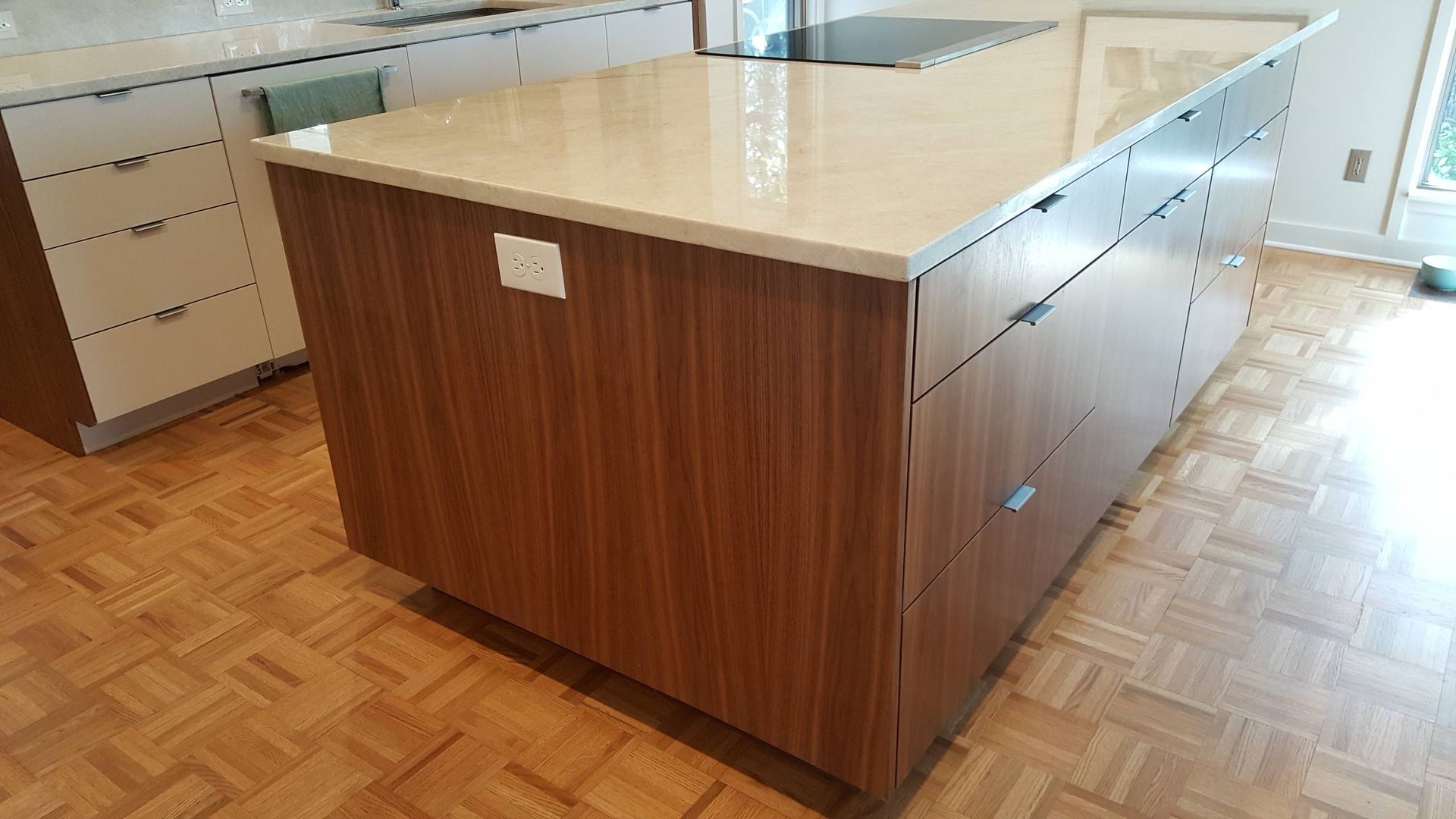 A kitchen with a large island in the middle of the room.