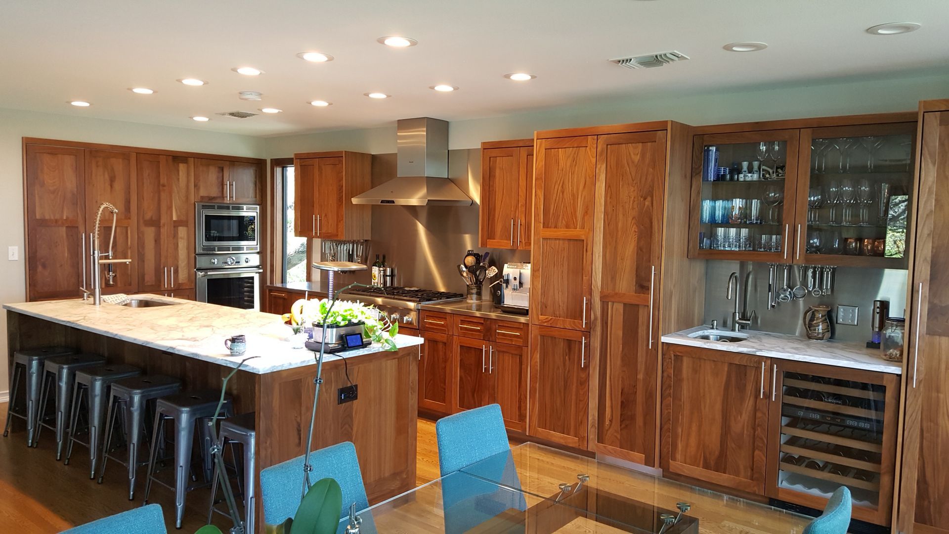 A large kitchen with wooden cabinets and stainless steel appliances