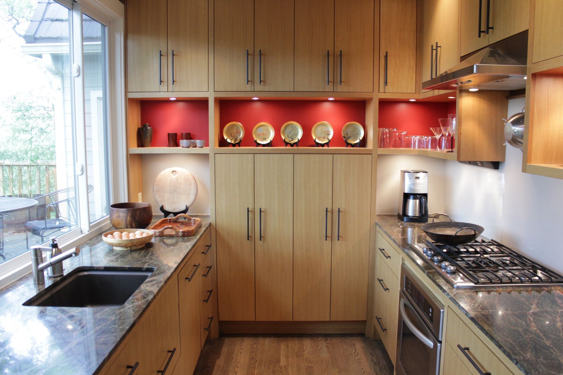 A kitchen with wooden cabinets and granite counter tops