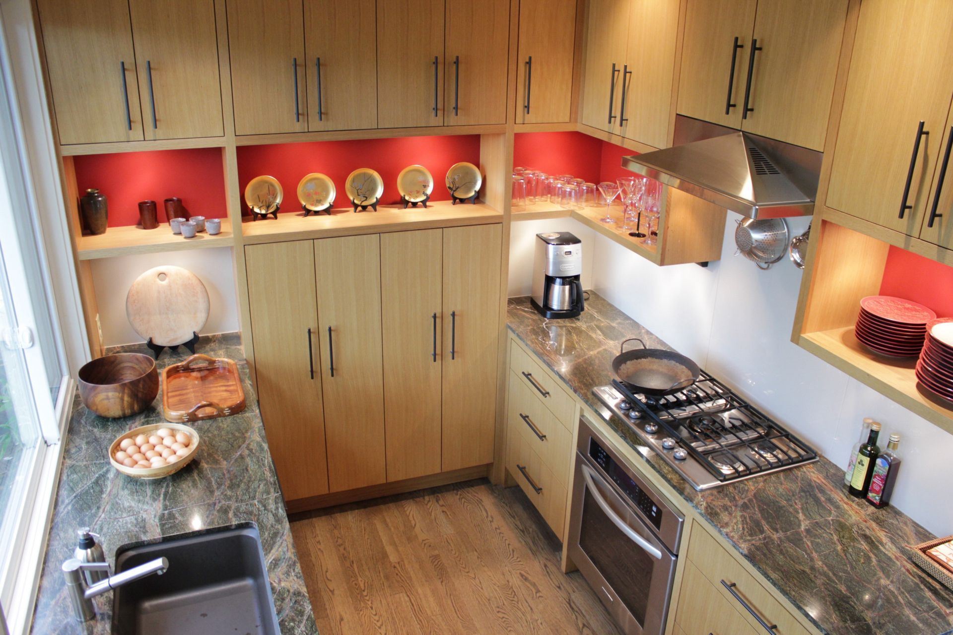 A kitchen with stainless steel appliances and wooden cabinets