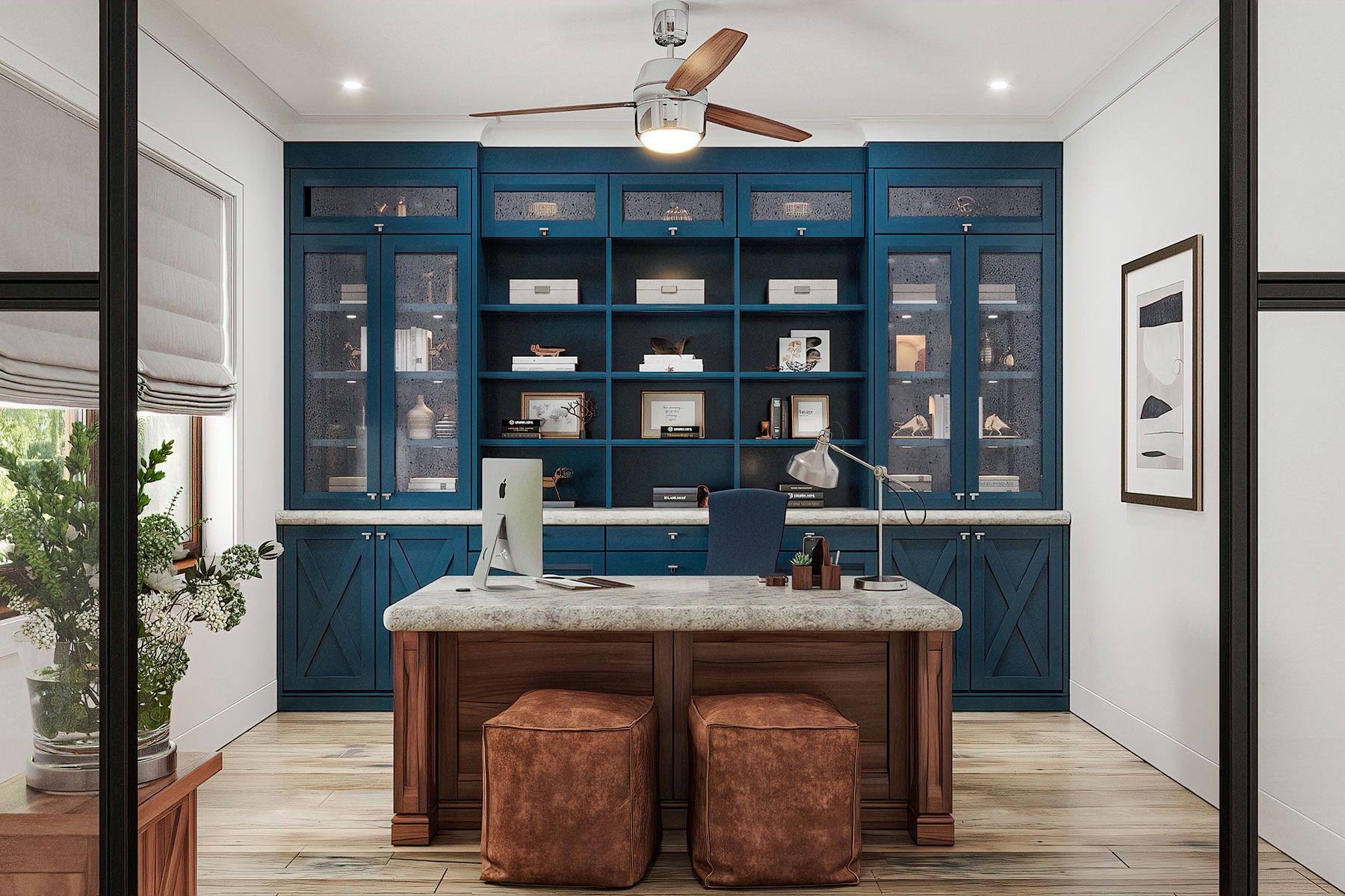 A home office with blue cabinets and a ceiling fan.
