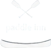 White bottle labeled โpaddle innโ with two crossed paddles near the top.