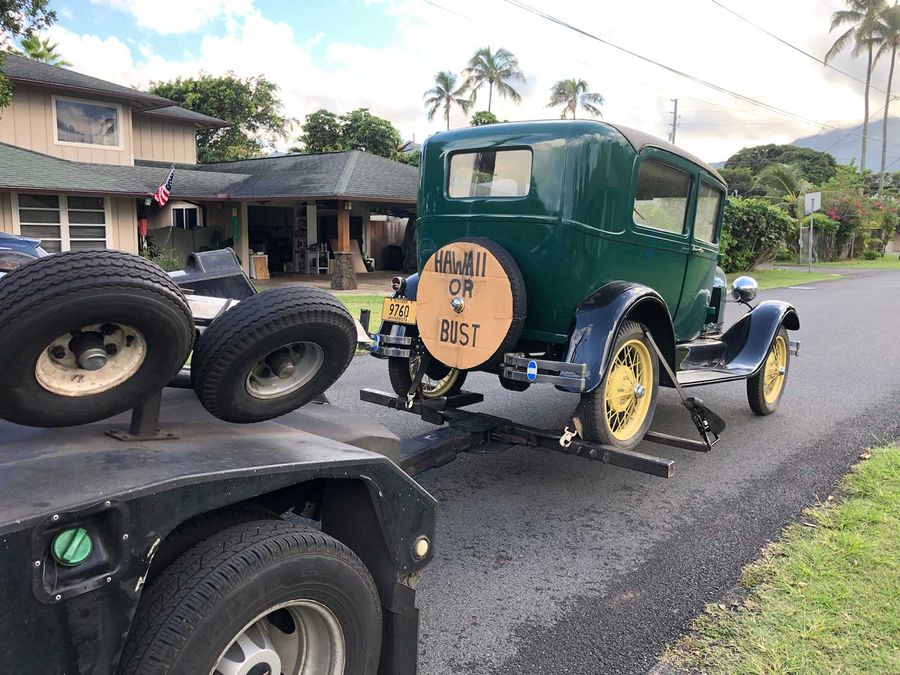 Green Tainted Car Towing — Honolulu, HI — Express Towing