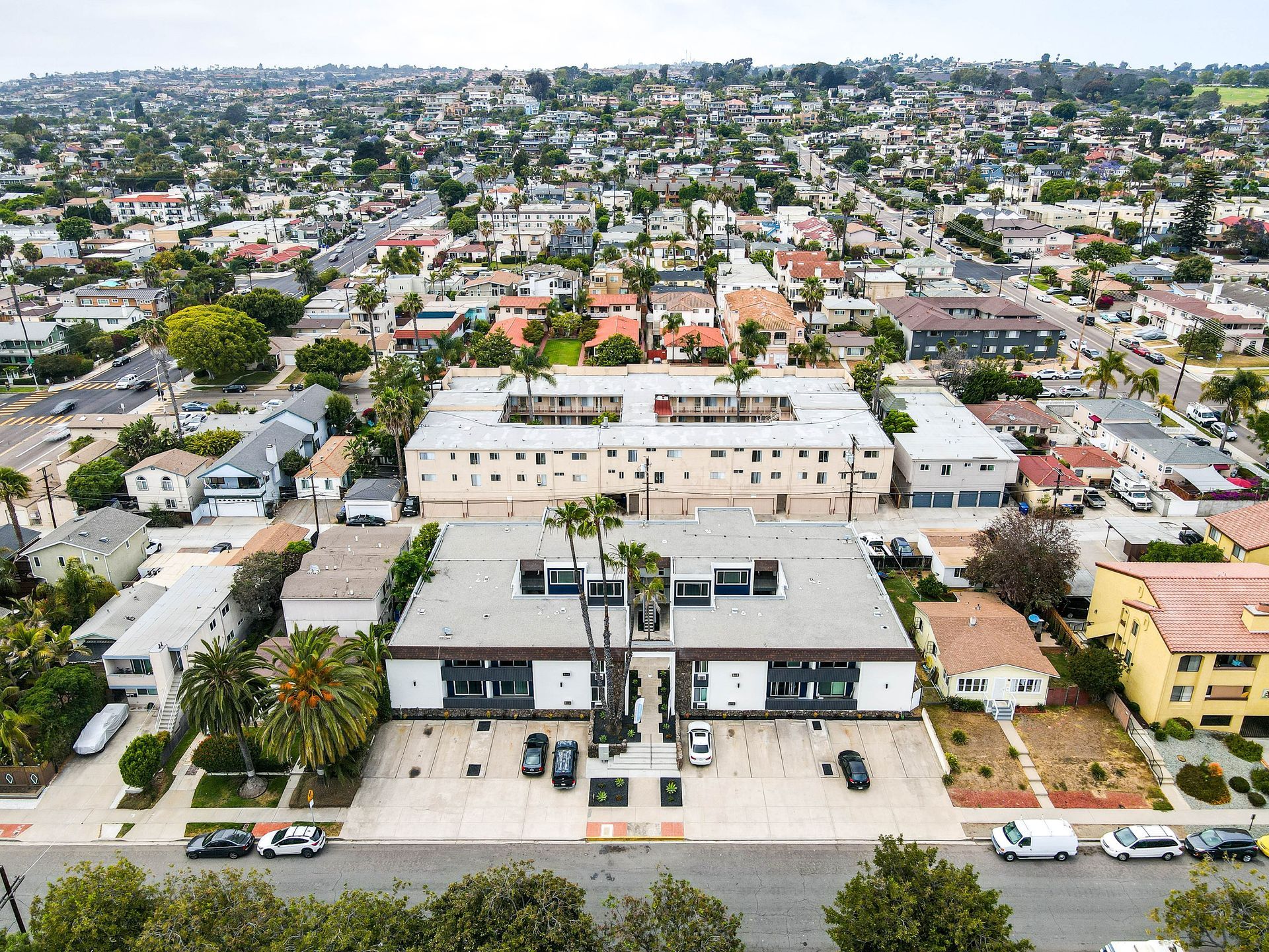 An aerial view of a large building in the middle of a city.
