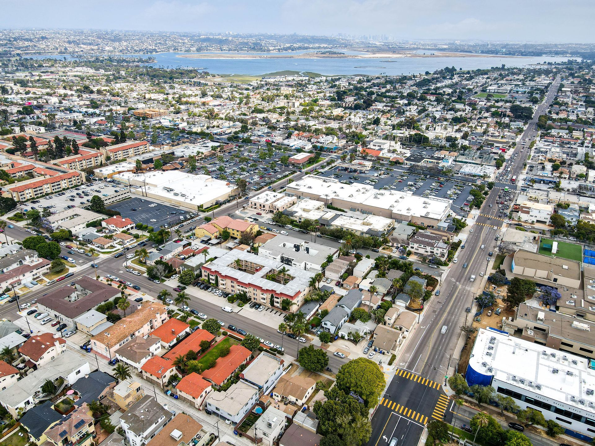 An aerial view of a city with a lot of buildings and trees.