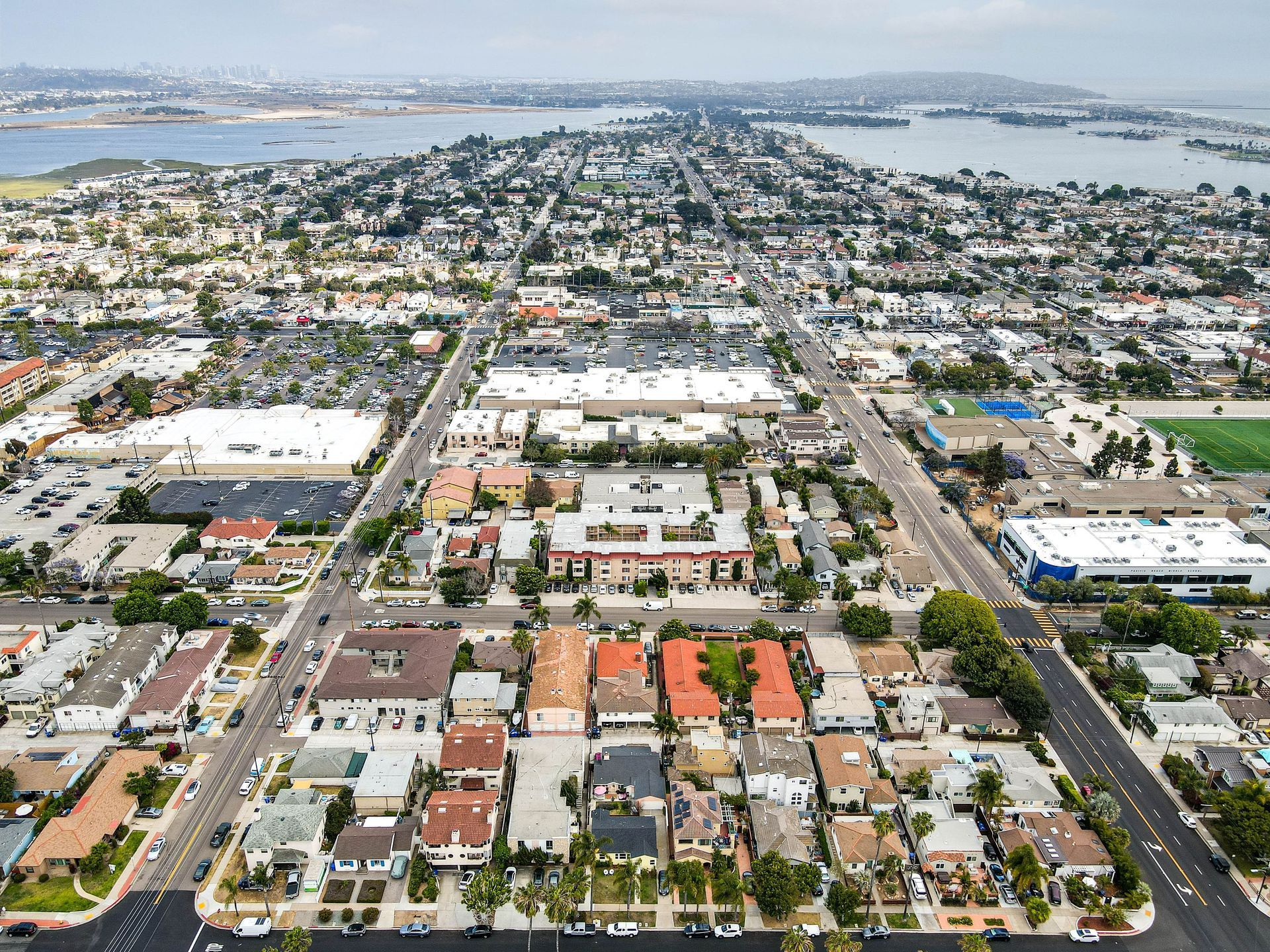 An aerial view of a city with a lot of buildings and trees.