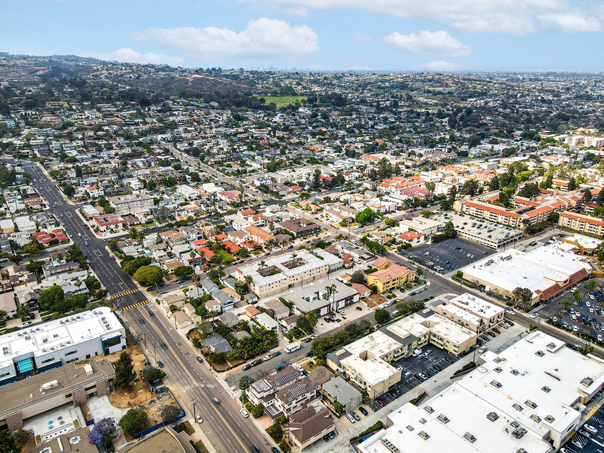 An aerial view of a city with lots of buildings and roads.