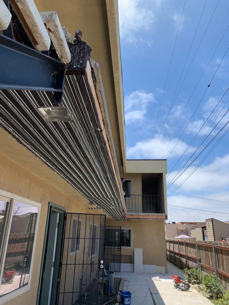 A building with a lot of pipes hanging from the ceiling.