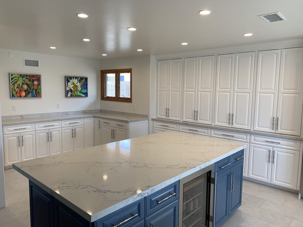 There is a large island in the middle of the kitchen.