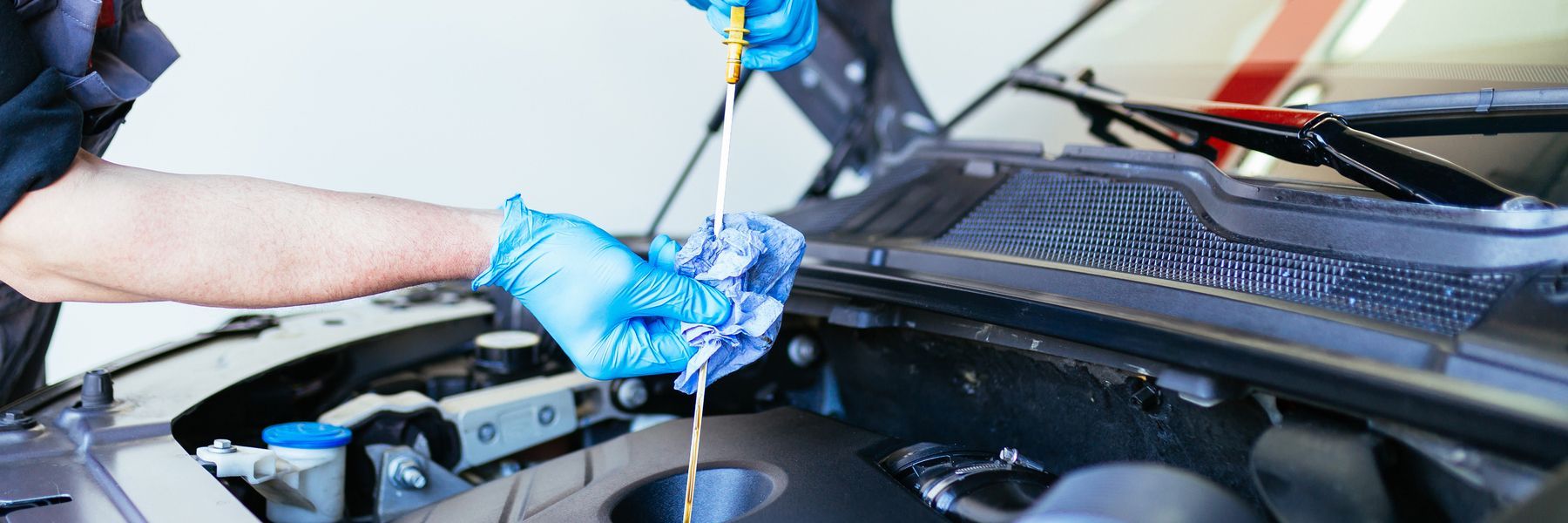 A close up of an engine oil cap on a car engine