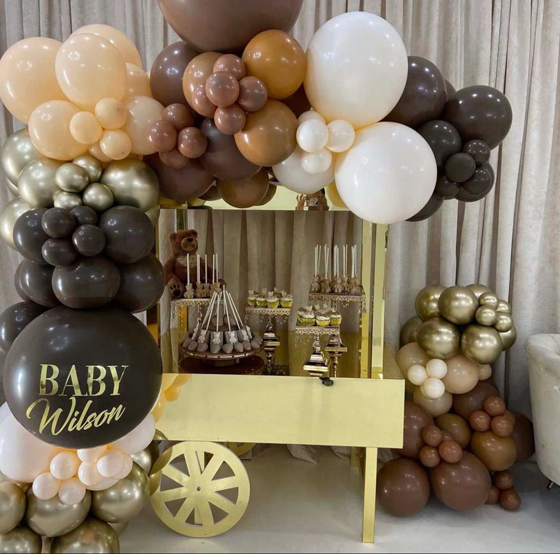 A baby Wilson balloon is surrounded by balloons