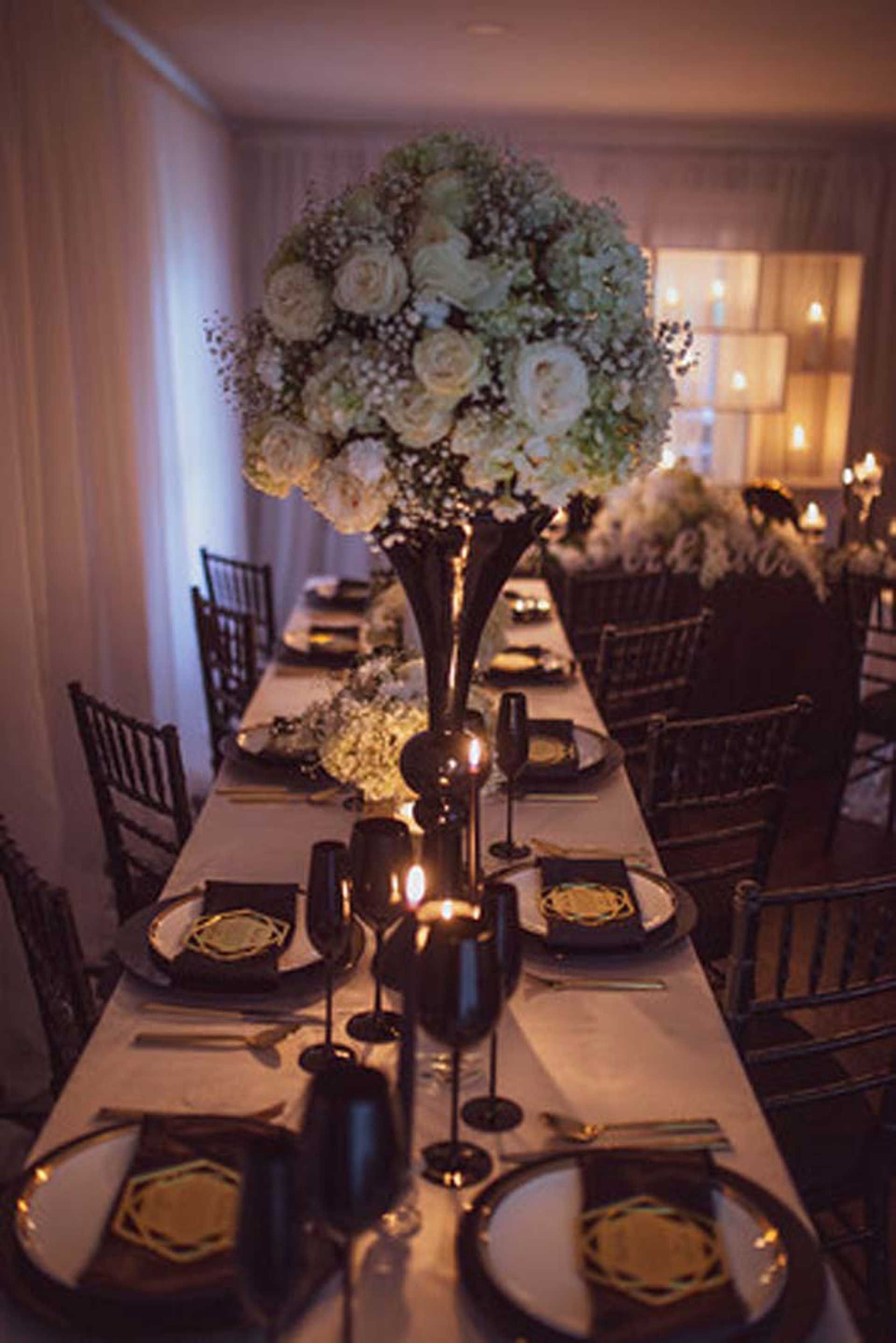 A long table with plates and candles