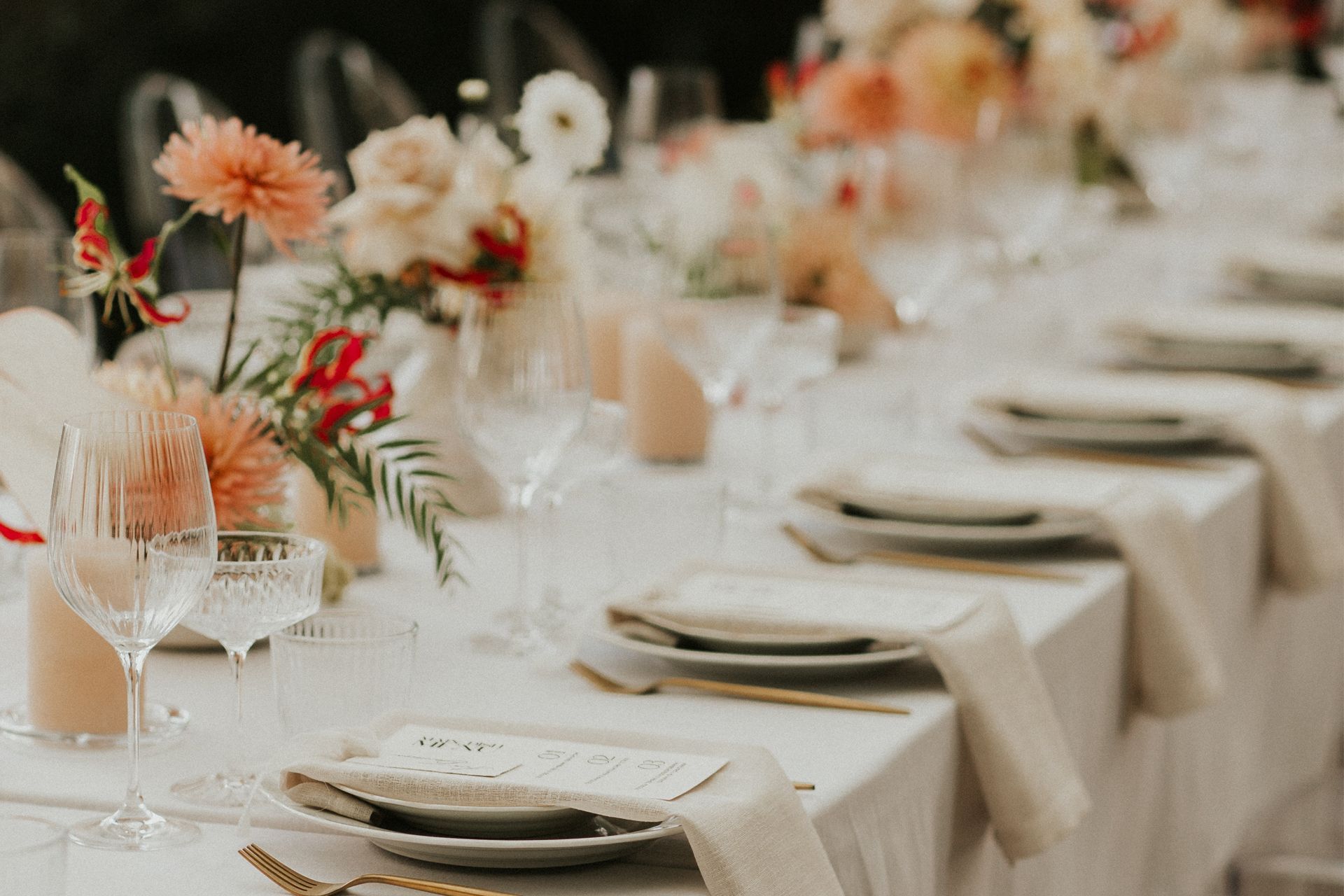 Long Table With Plates and Flowers