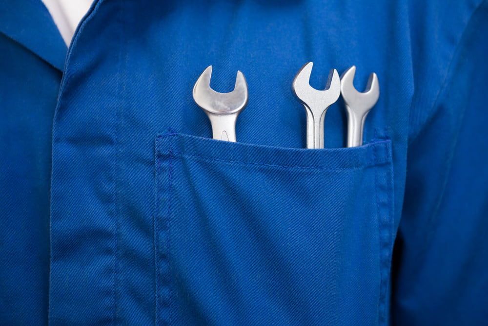 A Man in a Blue Coat Has Two Wrenches in His Pocket — Edgy Car Mechanics in Edgeworth, NSW